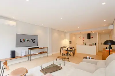 a living room with a white couch and a table at Liiiving in Porto - Pool Paradise Apartments in Porto