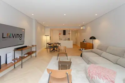 a living room with a couch and a table at Liiiving in Porto - Pool Paradise Apartments in Porto
