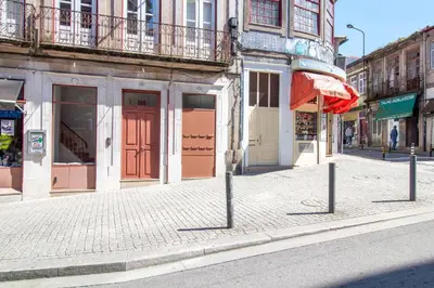 an empty street in a city with buildings at Bright Flat few steps to Aliados Av by LovelyStay in Porto