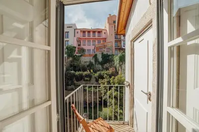 a balcony with a view of a city at Flores Premium by Hosty in Porto