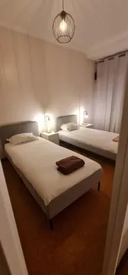 two beds in a room with two lamps on them at Catarina 711 in Porto