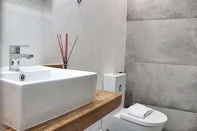 a bathroom with a sink and a toilet at Art Quarter Oporto City Center in Porto