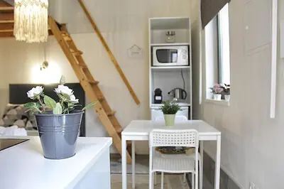 a kitchen with a white table and a white table at Art Quarter Oporto City Center in Porto