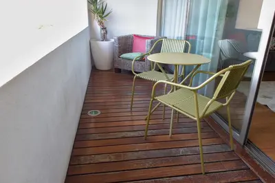 a room with chairs and a table on a balcony at Refúgio Douro à Vista in Porto