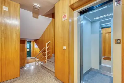 a hallway with a glass door in a building at 700 Verde Esperança in Porto