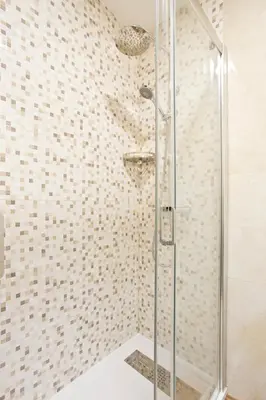 a shower with a glass door in a bathroom at Aposentus - CS Trindade Apartments in Porto