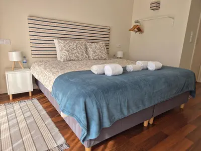 a bedroom with a large bed with towels on it at Sleep Swell in Porto