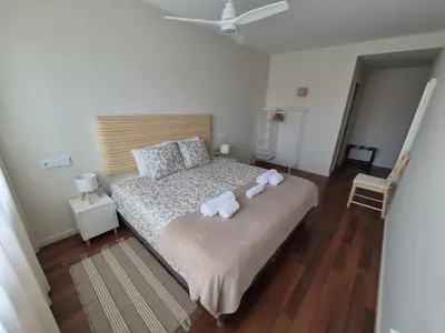 a bedroom with a bed with towels on it at Sleep Swell in Porto