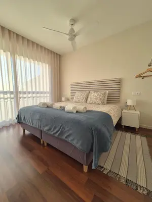 a bedroom with a large bed in a room at Sleep Swell in Porto