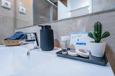 two towels are sitting on a table at New Alegria in Town 1 in Porto