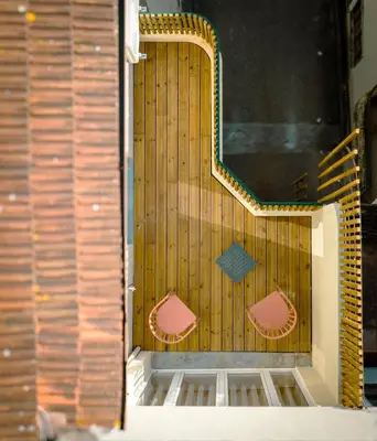 a wooden door with two chairs in front of it at The Cale - Porto, Firmeza 1 in Porto