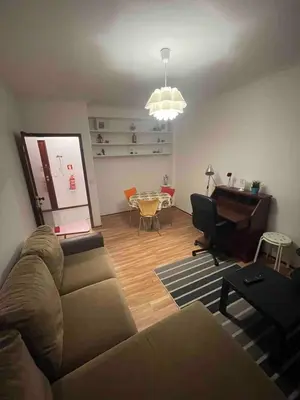 a living room with a couch and a table at T1 near El Corte Inglés in Vila Nova de Gaia