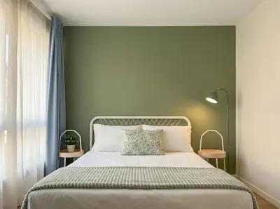 a living room with a christmas tree and a couch at Magnolia Suites & Stays in Porto