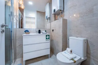 a hallway with a door leading to a bedroom at New Alegria in Town 2 in Porto