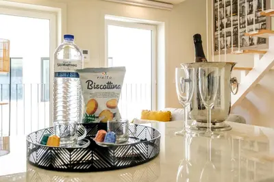 a table with a bottle of water and a blender at Luxury Style 4 with AC Downtown Porto near Metro in Porto