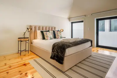 a bedroom with a bed and a large window at Luxury Style 4 with AC Downtown Porto near Metro in Porto