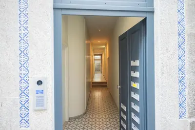 a hallway with a blue door and a hallway with a hallway at Luxury Style 7 with AC Downtown Porto near Metro in Porto
