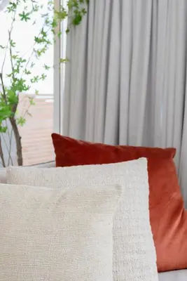 a group of pillows sitting on a couch with a window at Liiiving in Porto - Mezzanine Delight Balcony in Porto