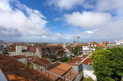 a view of a city with roofs and buildings at Liiiving in Porto - Mezzanine Delight Balcony in Porto