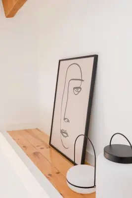 a mirror and two lights on a wooden shelf at Liiiving in Porto - Mezzanine Delight Balcony in Porto