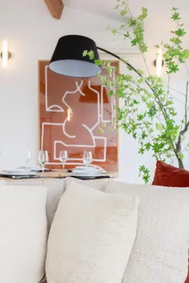 a living room with a couch and a table with a lamp at Liiiving in Porto - Mezzanine Delight Balcony in Porto
