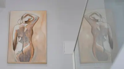 two paintings of a woman on a wall at Stylish Duplex with Balcony in Porto by LovelyStay in Porto