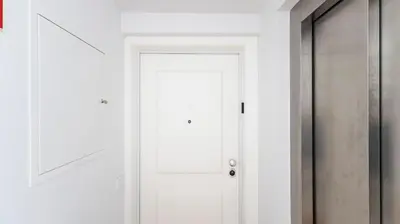 a white door in a white hallway at Stylish Duplex with Balcony in Porto by LovelyStay in Porto