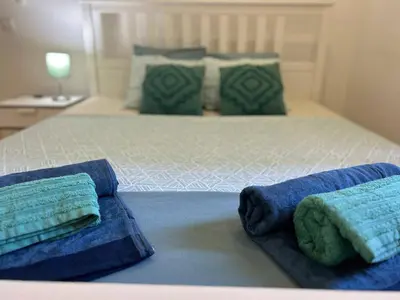 a bed with two pillows on top of it at Bonfim - Porto River in Porto
