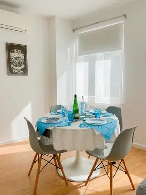 a dining room table with a blue and white table cloth at Bonfim - Porto River in Porto