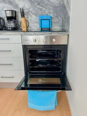an oven in a kitchen with a counter top at Bonfim - Porto River in Porto