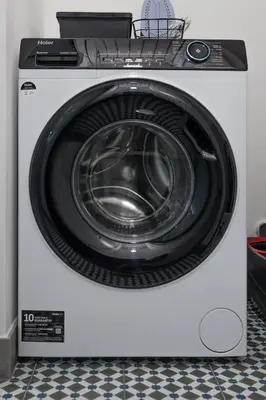 a white washing machine with its door open at Porto Cathedral III in Porto