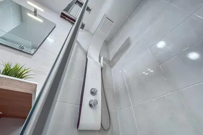 a bathroom with a shower with a glass door at Close to Everything Your Oporto Blue PRM 2F in Porto