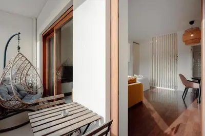 a room with a swing and a living room at Almada 516 by Best2Stay in Porto