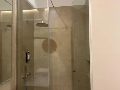 a shower with a glass door in a bathroom at Apartment in Market Bolhão- W Views 2F in Porto