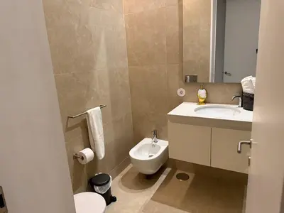 a bathroom with a toilet and a sink at Apartment in Market Bolhão- W Views 2F in Porto
