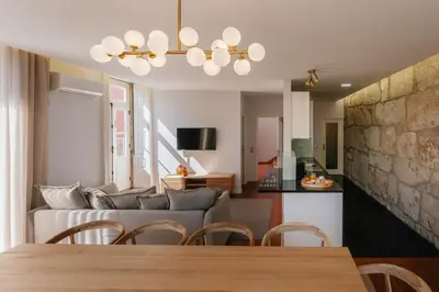 a living room with a couch and a table at Feel Porto Ribeira Vintage Duplex in Porto