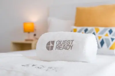 a pile of toilet paper sitting on top of a bed at GuestReady – The Mythic Apartments in Porto