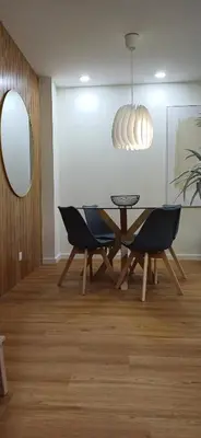 a dining room with a table and chairs and a mirror at Barramares Concept Lifestyle Oporto City Center in Porto
