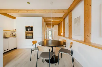 a kitchen and dining room with a table and chairs at GuestReady - Cedofeita Collection Apartments in Porto