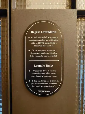 a laundry room with two washing machines in it at Panoramic Historic Views Private Terrace - Apt G in Porto