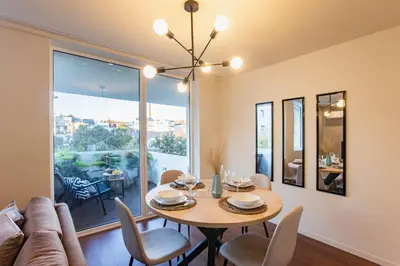 a dining room with a table and chairs at Porto Gallery District Escape, Central Retreat in Porto