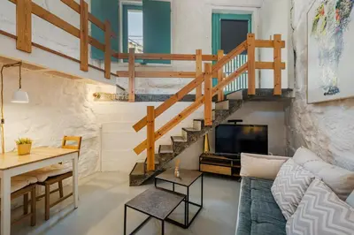 a living room with a couch and a table at GuestReady - A special place in Porto in Porto