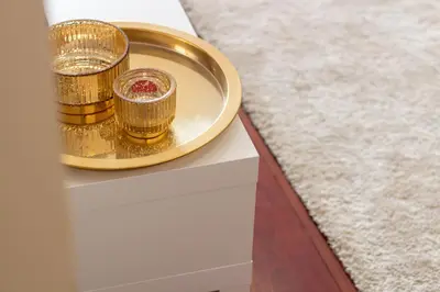 a gold tray with candles on top of a table at Santa Teresa Studio by LovelyStay in Porto