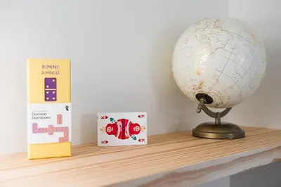 a globe sitting on a shelf next to a book at GuestReady - Clérigos Tiles House in Porto