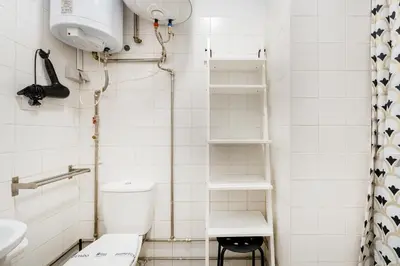 a small bathroom with a toilet and a sink at GuestReady - Peaceful retreat near Casa da Música in Porto