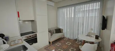 a small kitchen with a couch and a table at Apartamento D'Alegria in Porto
