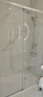 a shower with a glass door in a bathroom at Apartamento D'Alegria in Porto