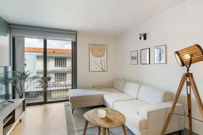a living room with a couch and a table at GuestReady - Lovely home in Campanhã in Porto