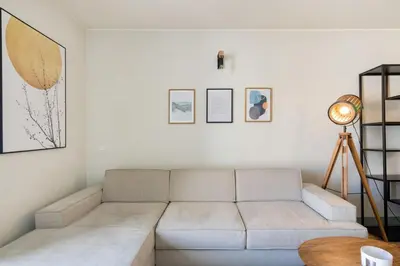 a living room with a couch and a table at GuestReady - Lovely home in Campanhã in Porto