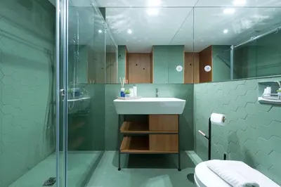 a room with a chair next to a window at Porto Riverviews | Monte dos Judeus in Porto